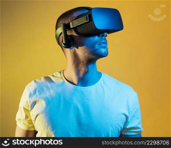 medium shot man wearing virtual reality gadget