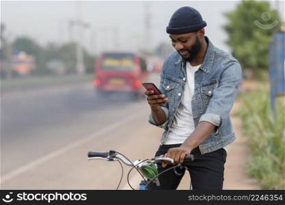 medium shot man with bicycle phone