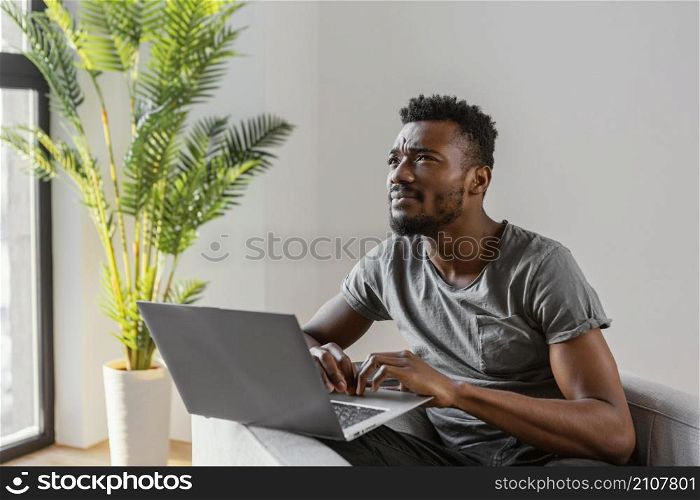 medium shot man with laptop thinking