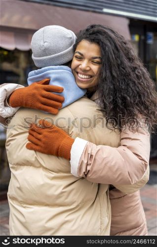 medium shot man woman hugging