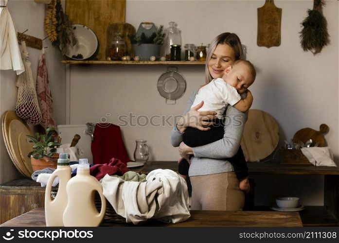 medium shot mother holding kid