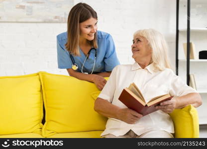 medium shot nurse talking old woman