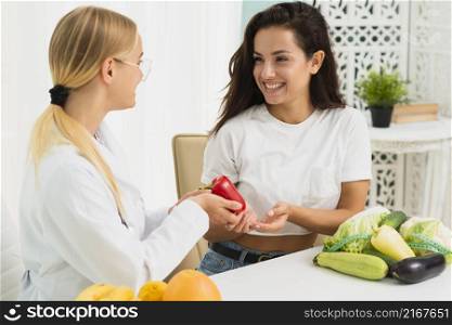 medium shot nutritionist discussing with patient