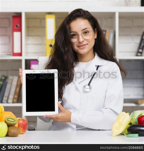 medium shot nutritionist holding tablet mock up