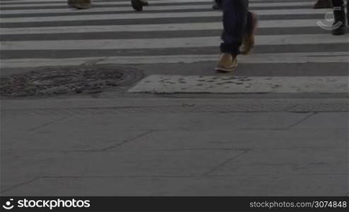 Medium shot of feet crossing the street in downtown Buenos Aires Argentina