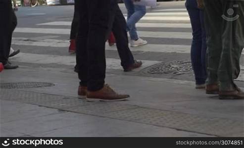 Medium shot of feet crossing the street in downtown Buenos Aires Argentina in slow motion series 3
