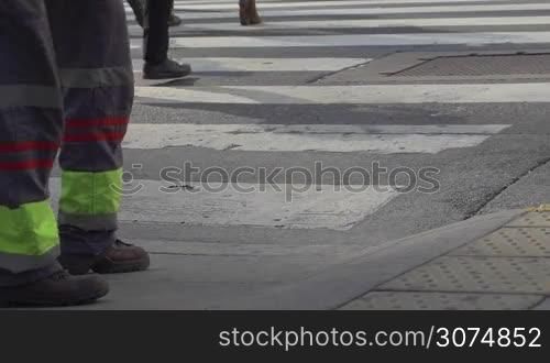 Medium shot of feet crossing the street in downtown Buenos Aires Argentina in slow motion series 2