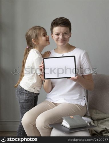 medium shot parent kid with tablet