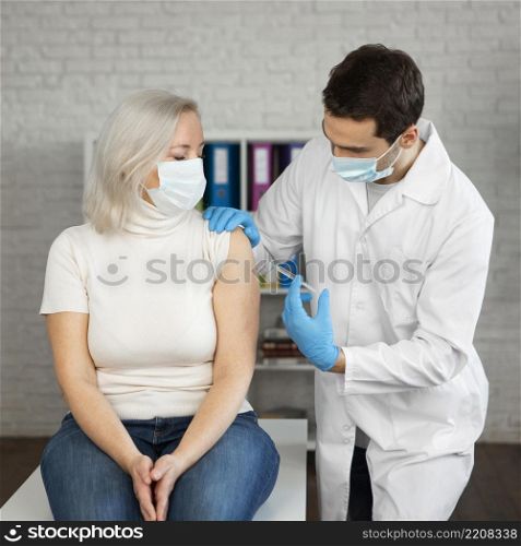 medium shot patient getting injection