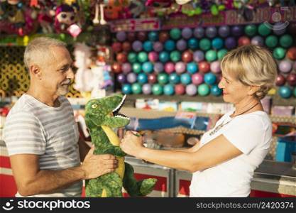 medium shot people with dinosaur toy