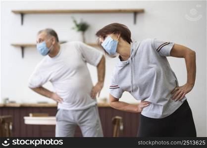 medium shot people working out with mask