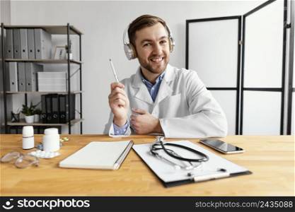 medium shot smiley doctor holding pen
