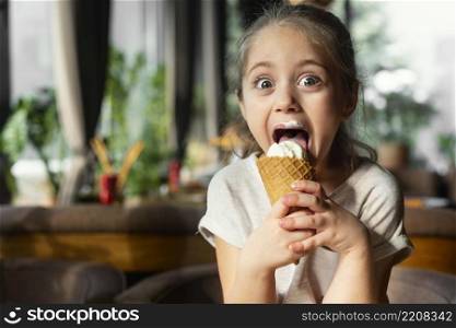 medium shot smiley girl eating ice cream
