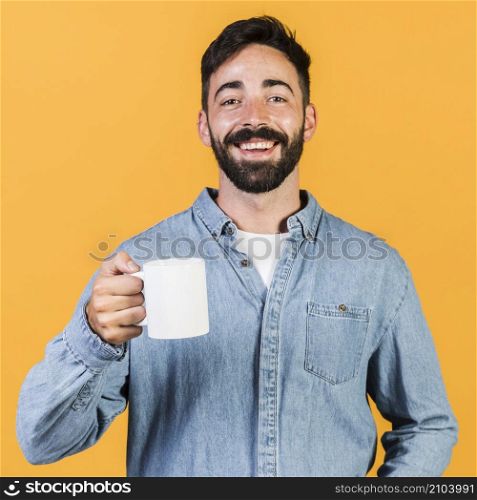 medium shot smiley guy holding cup