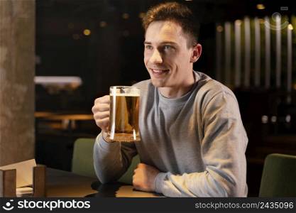 medium shot smiley man with beer