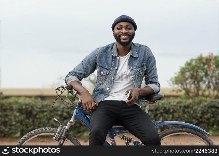 medium shot smiley man with bicycle nature