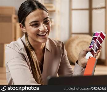 medium shot smiley woman holding color palette