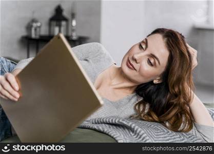 medium shot smiley woman holding tablet