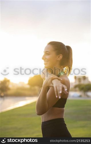 medium shot smiley woman stretching