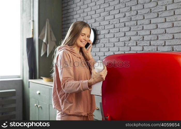 medium shot smiley woman talking phone