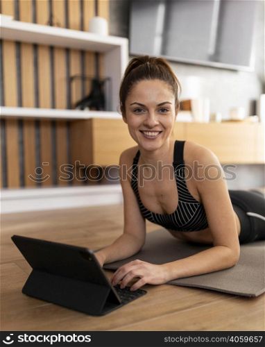 medium shot smiley woman with tablet