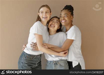 medium shot smiley women holding each other