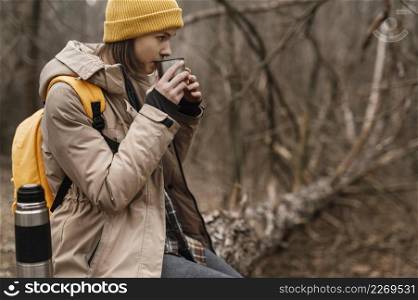 medium shot woman drinking coffee