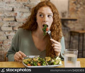 medium shot woman eating