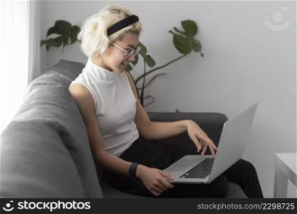 medium shot woman holding laptop