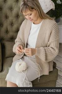 medium shot woman knitting high angle