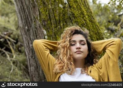 medium shot woman laying tree
