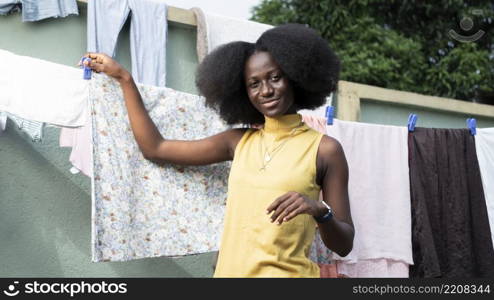 medium shot woman near laundry