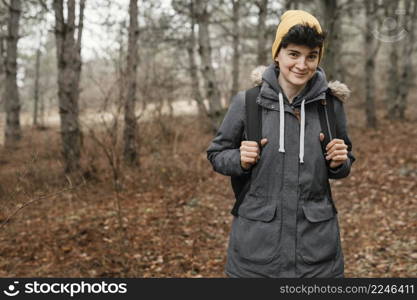 medium shot woman posing forest