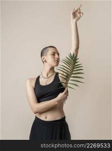 medium shot woman posing with plant