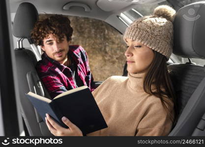 medium shot woman reading car