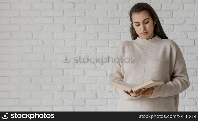 medium shot woman reading with copy space