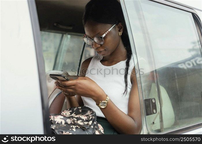 medium shot woman sitting car