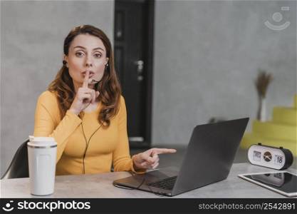 medium shot woman streaming laptop