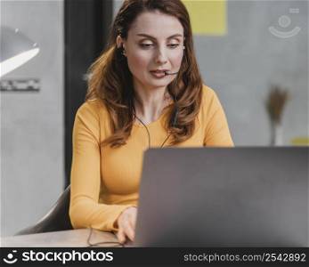 medium shot woman streaming with laptop