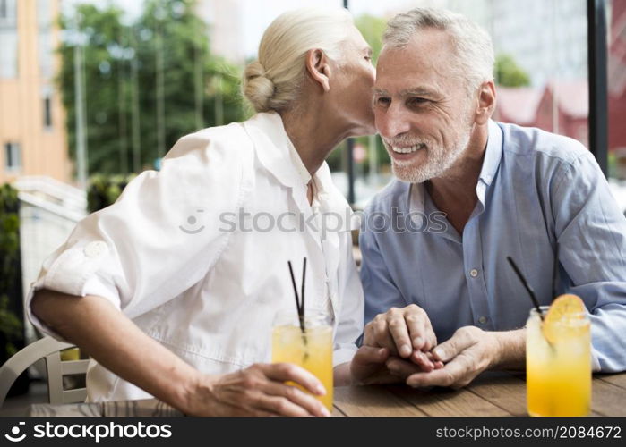 medium shot woman whispering man s ear