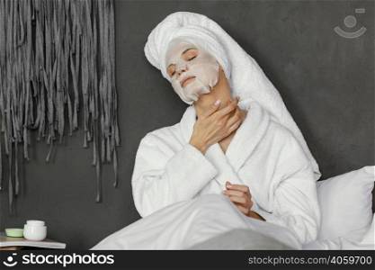 medium shot woman with facial mask