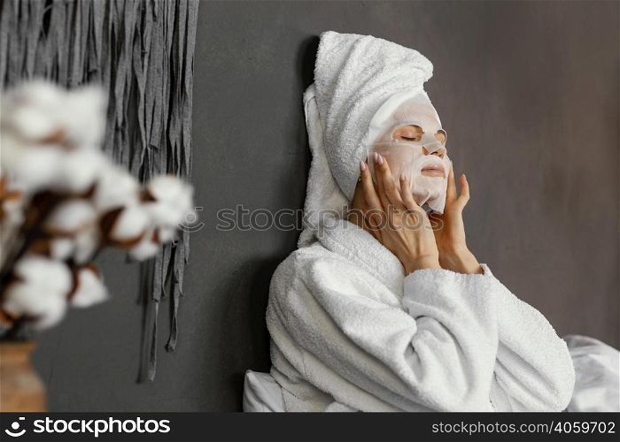 medium shot woman with moisturizing mask
