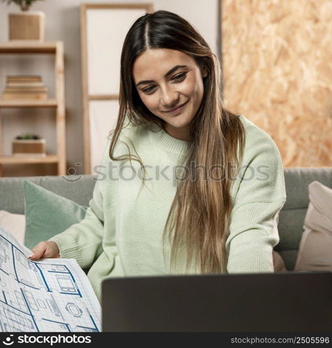 medium shot woman with plans