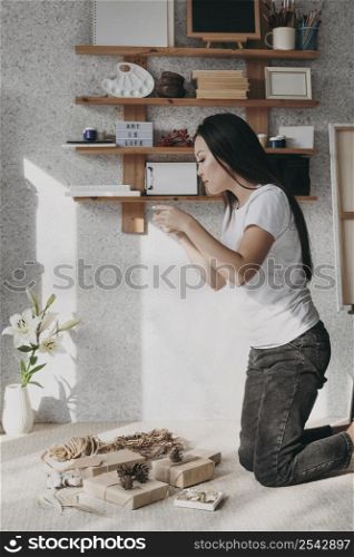 medium shot woman with presents home