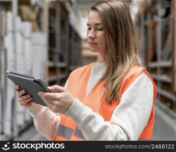 medium shot woman working with tablet