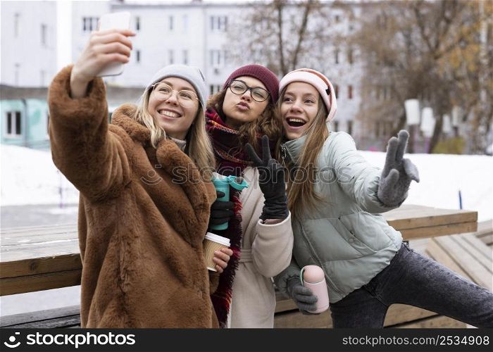 medium shot women posing winter