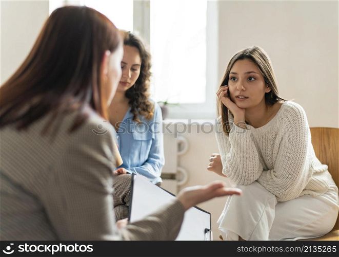 medium shot women talking therapy