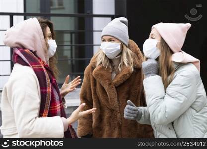 medium shot women wearing protective masks