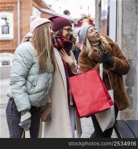medium shot women with shopping bags