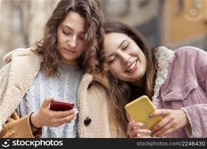 medium shot women with smartphones